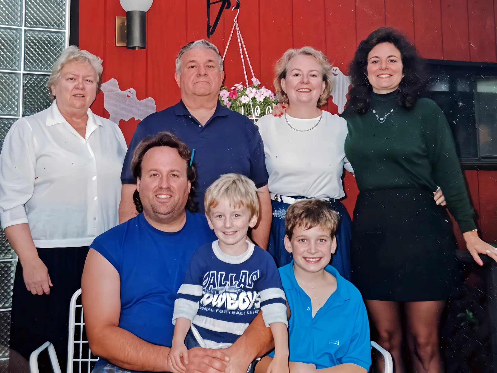 Family photo with Erik, his dad, and relatives