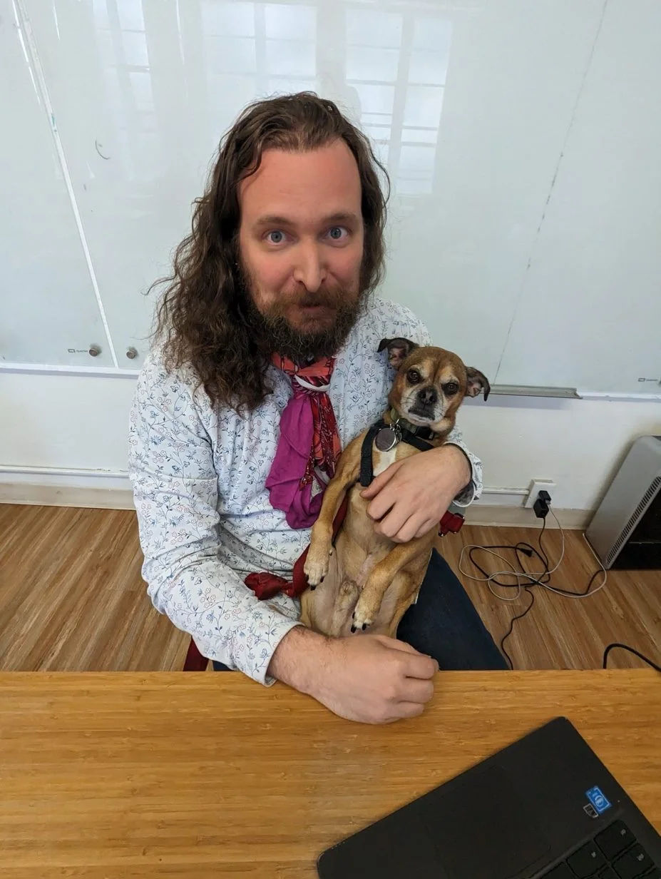 Erik Fuhrer and Moops at the desk