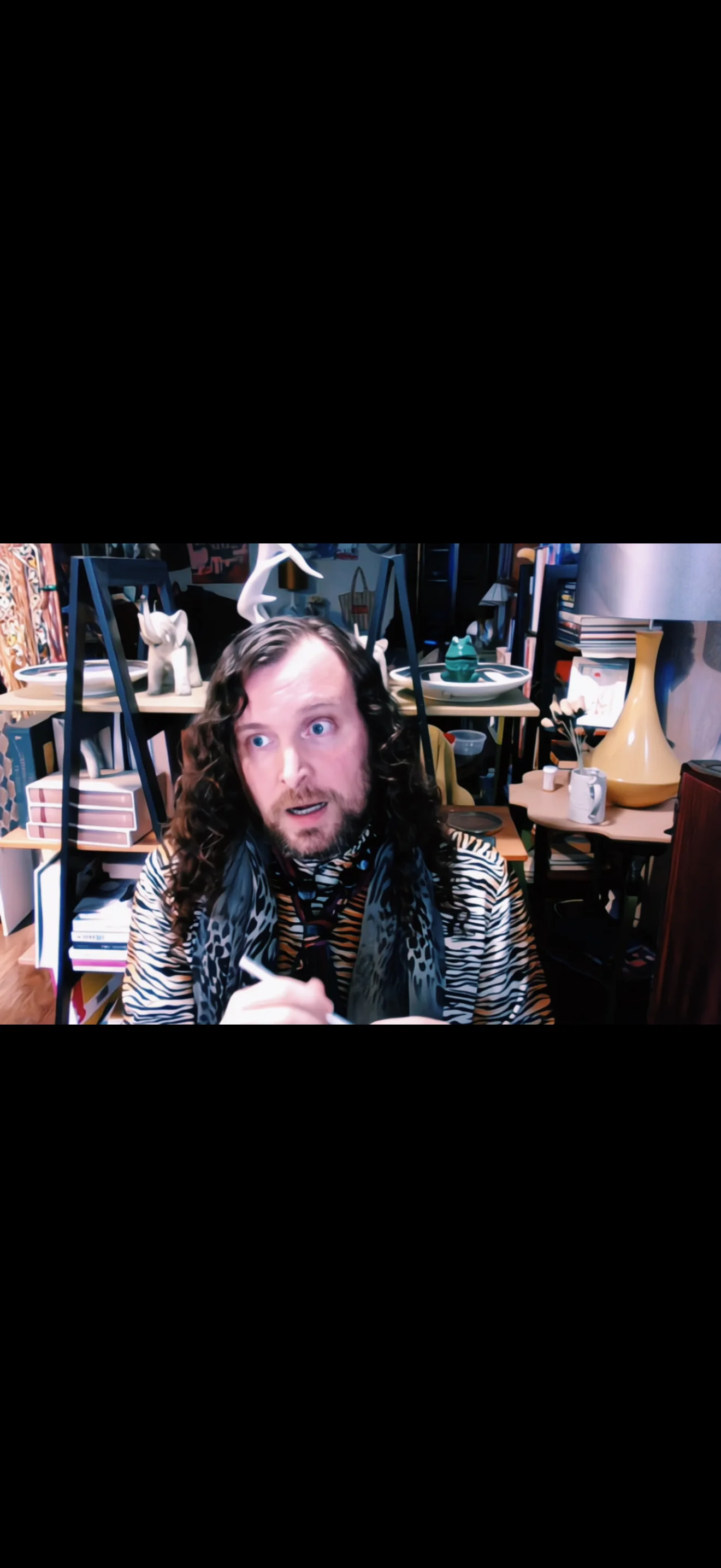 Erik Fuhrer writing at a desk, on writing trauma through the horror genre